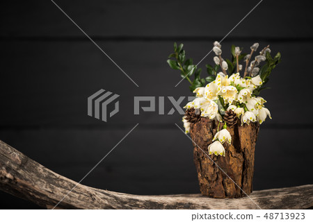 Flowers in decorative vase. Leucojum vernum Flowers in decorative vase. Leucojum vernum 48713923