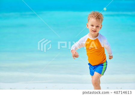Three year old toddler boy on beach 48714613