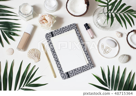 Lifestyle feminine desktop composition. Mockup of blank card. Notebook, skin cream, nail varnish and 48715364