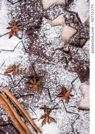 Cutting gingerbread cookies. Process of baking cookies at home. Cutting gingerbread cookies. Process of baking cookies at home. 48715374