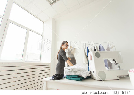 Dressmaker, fashion designer and tailor concept - Working process, young female fashion designer in 48716135