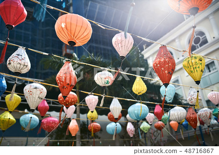 Asian city street decorated with traditional multicolored chinese lanterns Asian city street decorated with traditional multicolored chinese lanterns 48716867