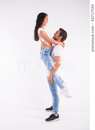 Passionate couple dancing social danse kizomba or bachata or semba or taraxia on white background Passionate couple dancing social danse kizomba or bachata or semba or taraxia on white background 48717040