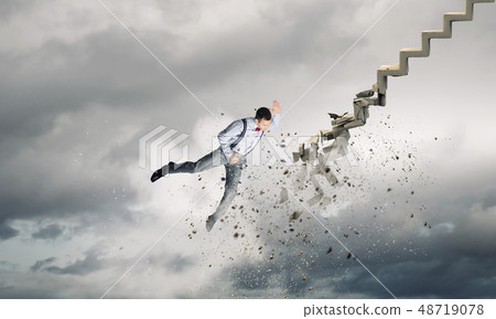 Man breaking ladder Man breaking ladder 48719078