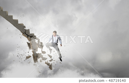 Man breaking ladder Man breaking ladder 48719140