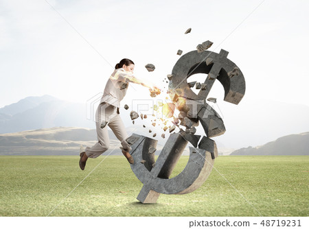 Woman attacking dollar symbol Woman attacking dollar symbol 48719231