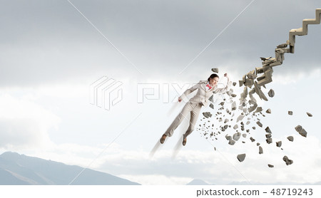 Man breaking ladder 48719243