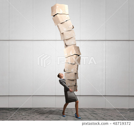 Woman carrying carton boxes Woman carrying carton boxes 48719372
