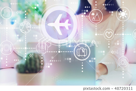 Airplane travel theme with woman using her laptop 48720311