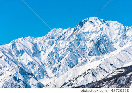 Snow mountain in Hakuba village and snowy landscape in blue sky 48720338