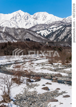 Snow mountain in Hakuba village and snowy landscape in blue sky 48720339