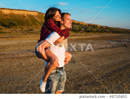 lovestory of couple on the beach On the Sunset lovestory of couple on the beach On the Sunset 48720803