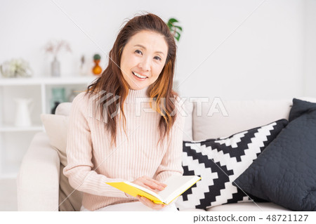 Senior woman reading a book Senior woman reading a book 48721127