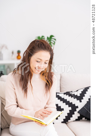 Senior woman reading a book Senior woman reading a book 48721128