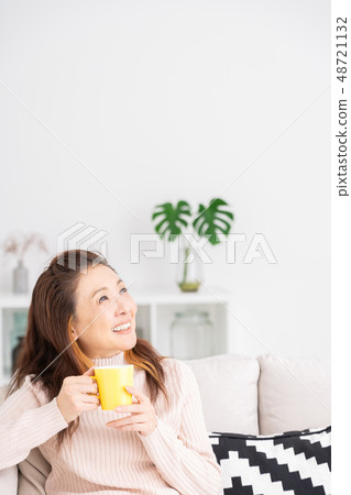 Senior women drink to relax in the room Senior women drink to relax in the room 48721132