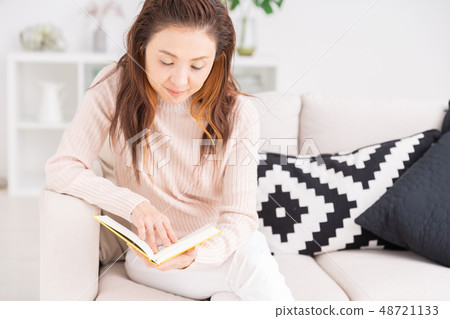 Senior woman reading a book Senior woman reading a book 48721133