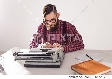 People and technology concept - Portrait of bearded man in plaid shirt typing over grey background People and technology concept - Portrait of bearded man in plaid shirt typing over grey background 48721705