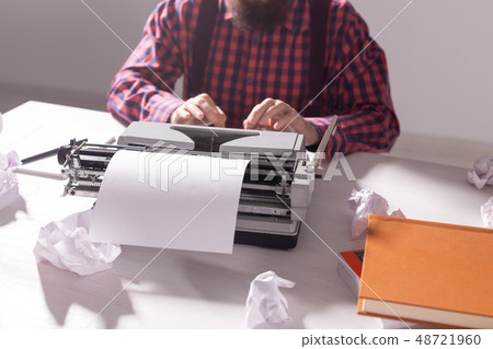 people, writer and hipster concept - young stylish writer working on typewriter 48721960