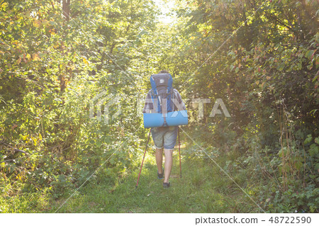 People, hike, tourism and nature concept - Man in the forest 48722590