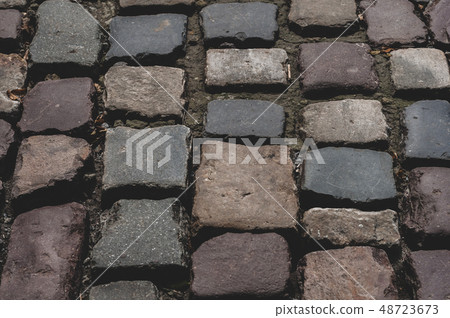 Pavement from a smooth textured old natural stone Pavement from a smooth textured old natural stone 48723673
