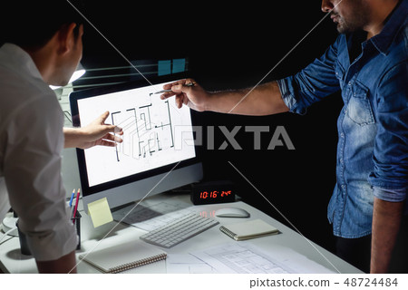 Architect team discussing project at night 48724484