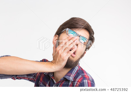 Expression and gesture concept - Handsome man with awkward face Expression and gesture concept - Handsome man with awkward face 48725392