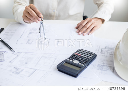 Close-up Of Person's engineer Hand Drawing Plan On Close-up Of Person's engineer Hand Drawing Plan On 48725896