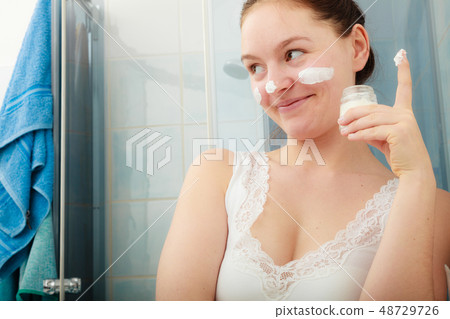 Woman with moisturizing skin cream. Skincare. Woman with moisturizing skin cream. Skincare. 48729726