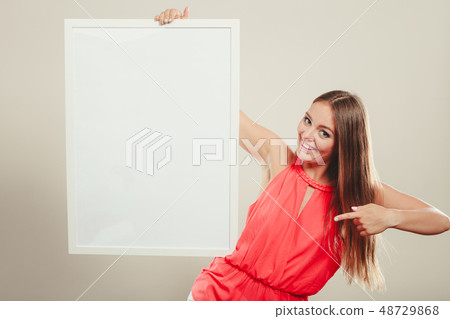 Cute fashion woman with blank empty white banner. 48729868