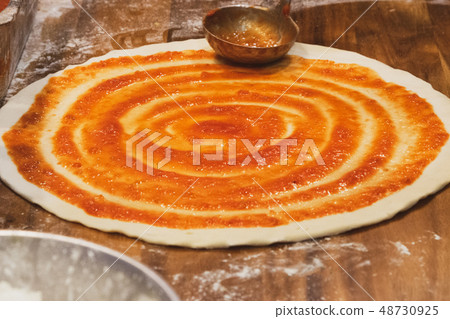 chef prepares delicious pizza on the kitchen 48730925