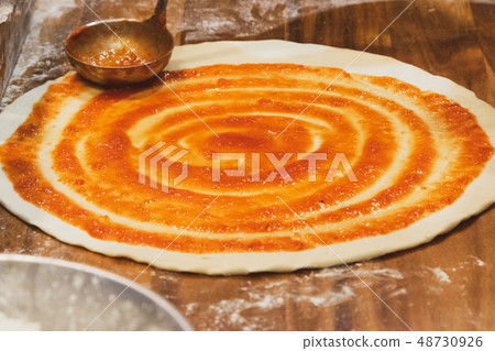 chef prepares delicious pizza on the kitchen 48730926