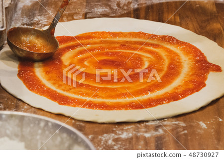 chef prepares delicious pizza on the kitchen 48730927