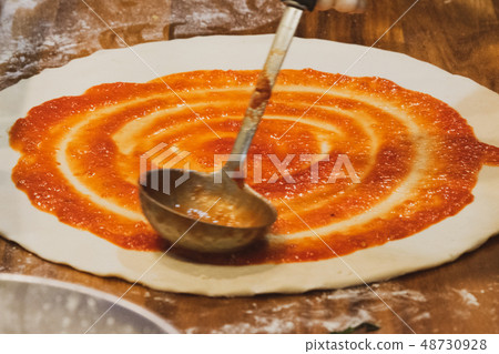 chef prepares delicious pizza on the kitchen 48730928