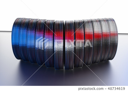 New winter tires with a modern tread on the black background. 48734619
