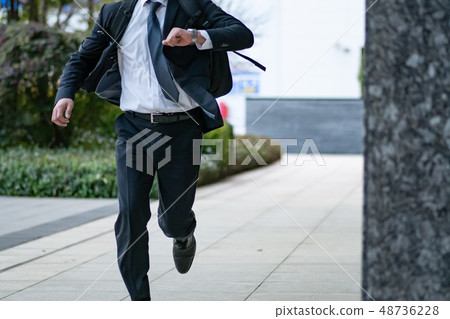 Outdoor businessman runs 48736228