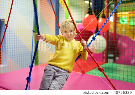 Fanny little boy after activity on trampoline Fanny little boy after activity on trampoline 48736329