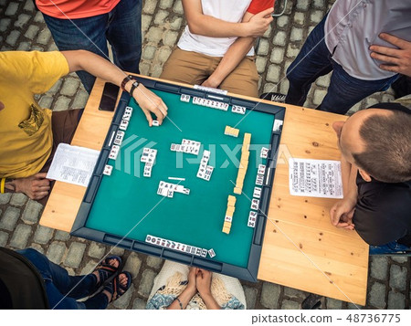 People Playing Mahjong Asian Tile-based Game. Table Gambling top view 48736775