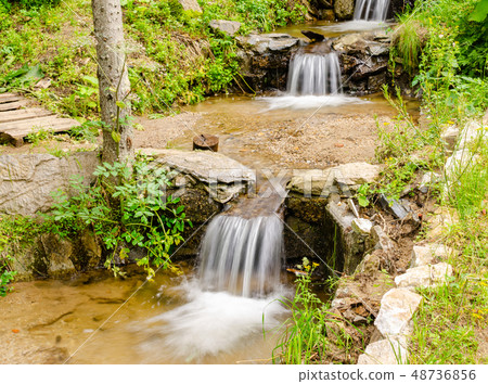 Waterfalls in summertime Waterfalls in summertime 48736856