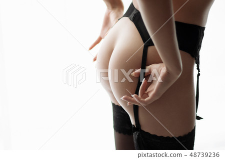 Girl with a naked ass in a corset 48739236