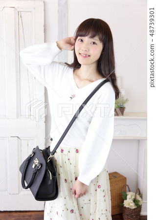 A young woman going out A young woman going out 48739301
