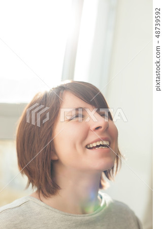 Happy girl laughs because of good news. Happy girl laughs because of good news. 48739592