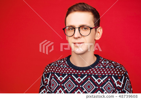 Portrait of a man with glasses and a sweater Portrait of a man with glasses and a sweater 48739608