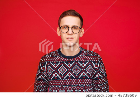 Portrait of a man with glasses and a sweater Portrait of a man with glasses and a sweater 48739609