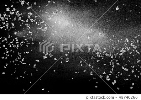 Split debris of stone exploding with white powder. Split debris of stone exploding with white powder. 48740266