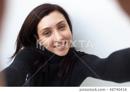 Beautiful black-haired girl in black clothes 48740416