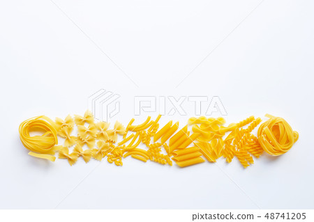Different types of dry pasta on white. Different types of dry pasta on white. 48741205