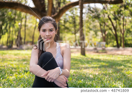 Concept of exercise. Beautiful girl stretching the Concept of exercise. Beautiful girl stretching the 48741809