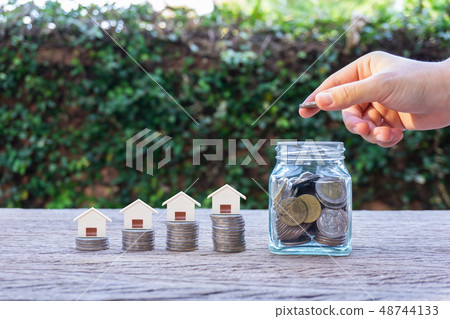 Saving for buying house or real estate investment. 48744133