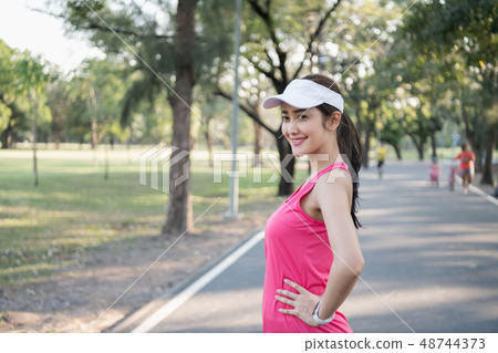 Exercise concept. A beautiful girl is training her body with exe Exercise concept. A beautiful girl is training her body with exe 48744373