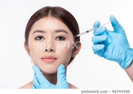 Surgery concept. The doctor cosmetologist makes the Rejuvenating Surgery concept. The doctor cosmetologist makes the Rejuvenating 48744390